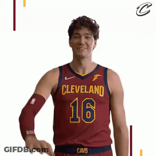 A Basketball Player In A Cleveland Cavs Jersey Is Waving His Hand . GIF