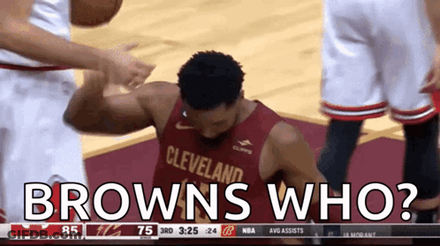 A Basketball Player In A Cleveland Jersey Is Getting A High Five From Another Player GIF