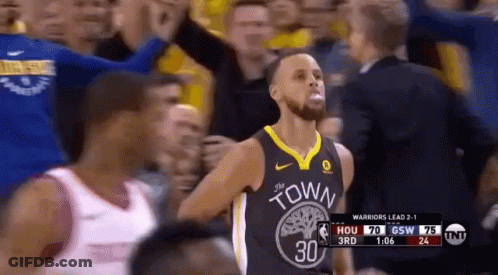 A Basketball Player In A Golden State Warriors Jersey Stands In Front Of A Crowd . GIF
