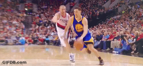 A Basketball Player In A Golden State Warriors Uniform Dribbles The Ball GIF