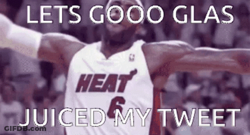 A Basketball Player In A Heat Jersey With His Arms In The Air GIF