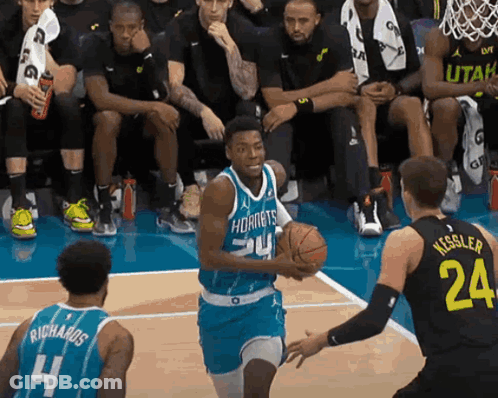 A Basketball Player In A Hornets Jersey Dribbles The Ball GIF