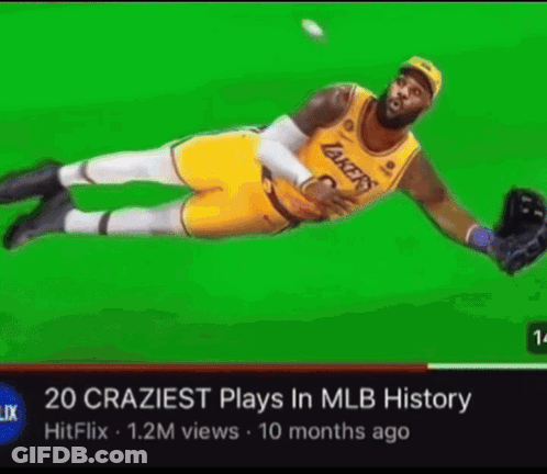 A Basketball Player In A Lakers Uniform Is Catching A Ball On A Green Screen . GIF