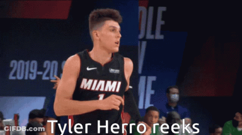 A Basketball Player In A Miami Jersey Is Running GIF