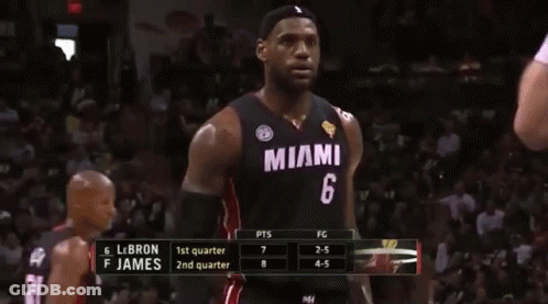 A Basketball Player In A Miami Jersey Stands On The Court GIF