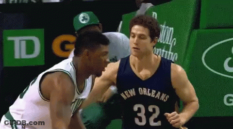 A Basketball Player In A New Orleans Jersey Is Talking To Another Player GIF