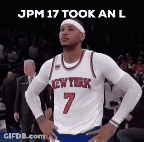 A Basketball Player In A New York Jersey Is Standing With His Hands On His Hips On A Court . GIF