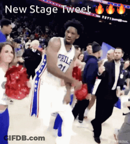 A Basketball Player In A Philadelphia Jersey Is Dancing On The Court GIF