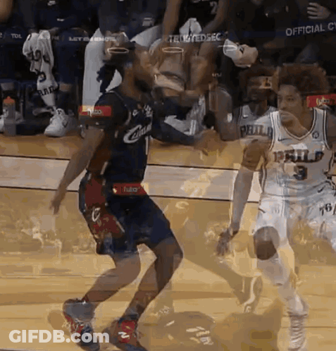 A Basketball Player In A Philadelphia Jersey Is Dribbling The Ball GIF