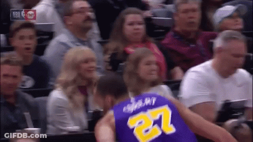 A Basketball Player In A Purple Jersey With The Number 27 On The Back GIF