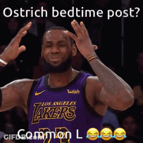 A Basketball Player In A Purple Lakers Jersey Is Making A Funny Face GIF