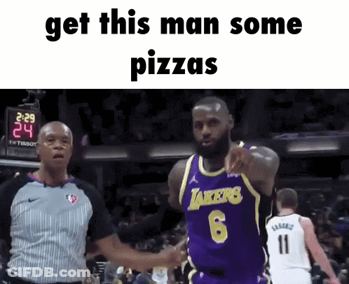 A Basketball Player In A Purple Lakers Jersey Shakes Hands With A Referee GIF