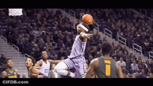 A Basketball Player In A Purple Uniform With The Number 23 On His Jersey GIF
