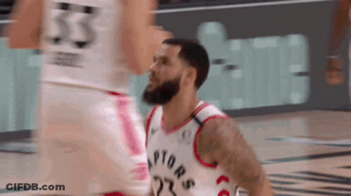 A Basketball Player In A Raptors Jersey Is Getting Ready To Shoot A Shot . GIF