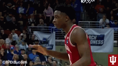 A Basketball Player In A Red Jersey Is Jumping In The Air GIF