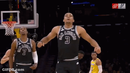 A Basketball Player In A San Antonio Jersey Stands In Front Of A Basketball Net GIF