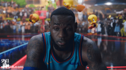 A Basketball Player In A Space Jam Jersey Looks At The Camera GIF