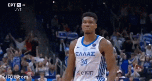 A Basketball Player In A White And Blue Jersey With The Number 34 On It GIF