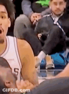 A Basketball Player In A White Jersey With The Number 5 On It Is Talking To Another Player . GIF