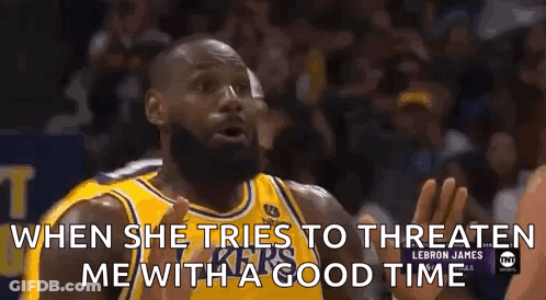 A Basketball Player In A Yellow Jersey Is Talking To Another Player During A Game . GIF