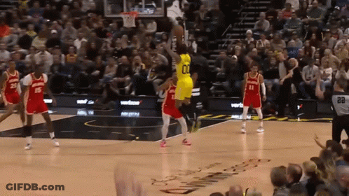 A Basketball Player In A Yellow Jersey With The Number 01 On It GIF
