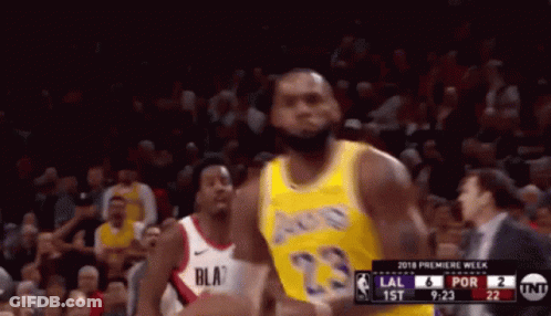 A Basketball Player In A Yellow Jersey With The Number 23 GIF