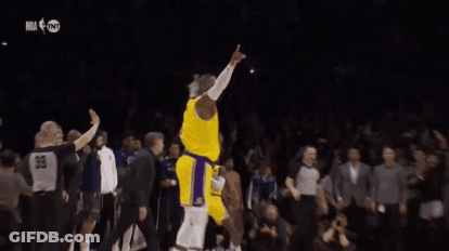 A Basketball Player In A Yellow Jersey With The Number 6 On It Is Dancing On The Court . GIF