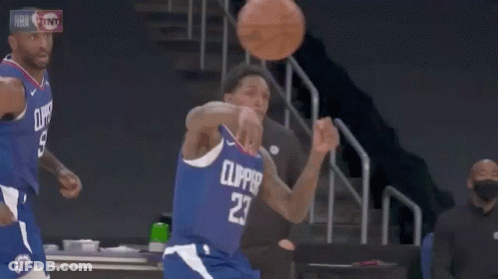 A Basketball Player In A Yellow Jersey With The Number 8 On It GIF