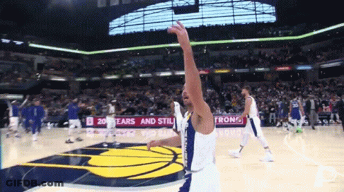 A Basketball Player In Front Of A Sign That Says Ears And Stiles GIF