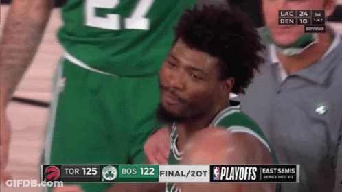 A Basketball Player Is Being Helped Off The Court During A Game Between The Celtics And The Raptors GIF