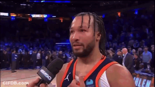 A Basketball Player Is Being Interviewed By A Microphone With Msg On It GIF