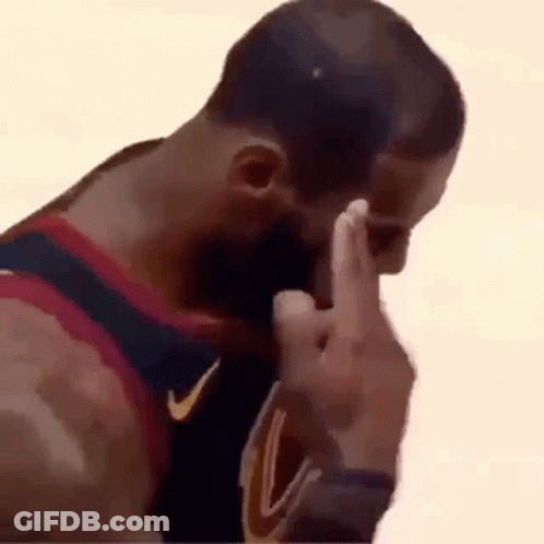 A Basketball Player Is Covering His Face With His Hand While Giving The Middle Finger . GIF