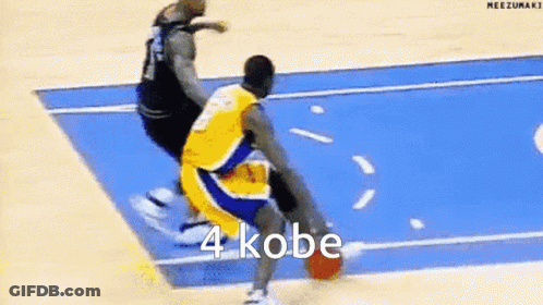 A Basketball Player Is Dribbling A Basketball On A Blue Court While Another Player Tries To Stop Him . GIF