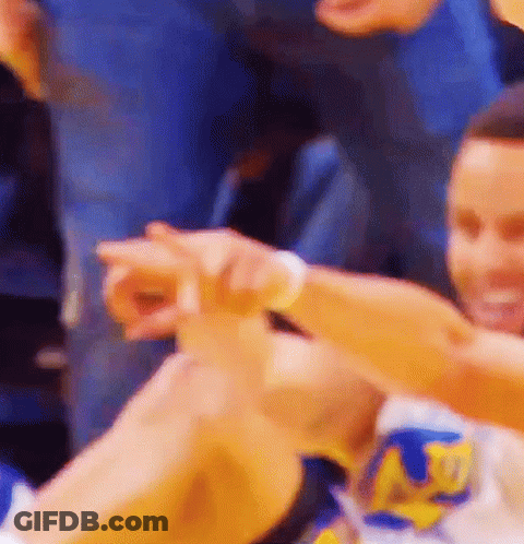 A Basketball Player Is Giving A High Five To His Teammate While Sitting On The Floor . GIF