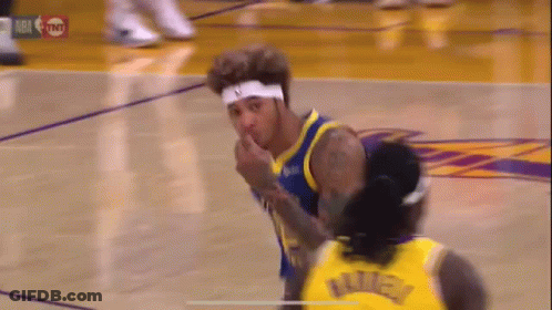 A Basketball Player Is Giving A Middle Finger To Another Player On A Court . GIF