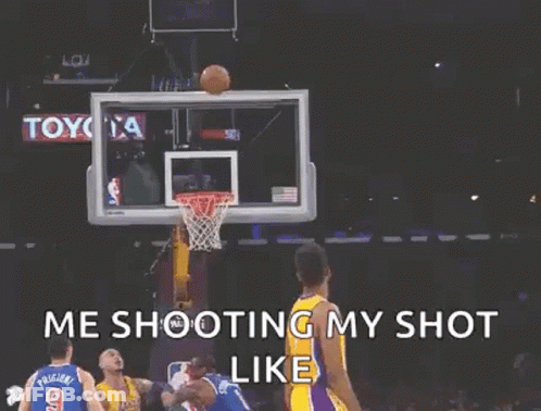 A Basketball Player Is Holding A Basketball In Front Of A Basketball Net . GIF