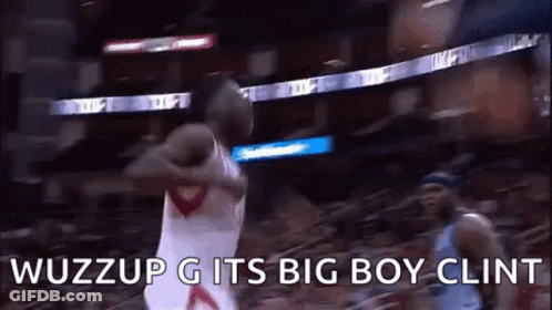 A Basketball Player Is Jumping In The Air While Holding A Basketball In His Hand . GIF