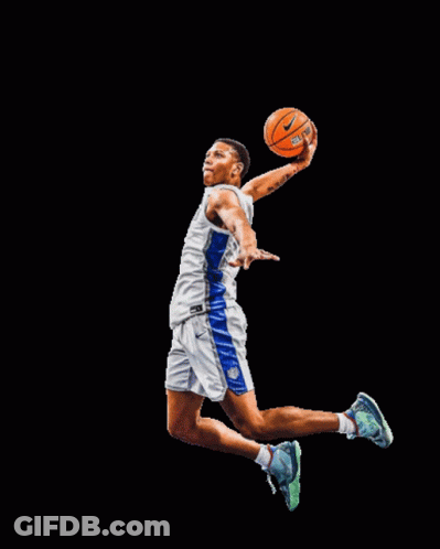 A Basketball Player Is Jumping In The Air While Holding An Orange Ball GIF