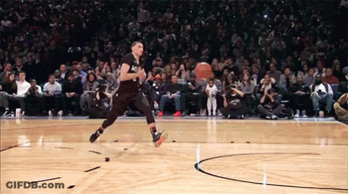 A Basketball Player Is Jumping In The Air While Wearing A Black Jersey With The Number 1 On It GIF