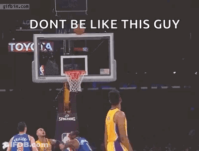 A Basketball Player Is Jumping In The Air With His Arms Outstretched In Front Of A Basketball Net . GIF