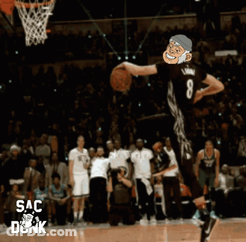 A Basketball Player Is Jumping In The Air With The Number 8 On His Jersey GIF
