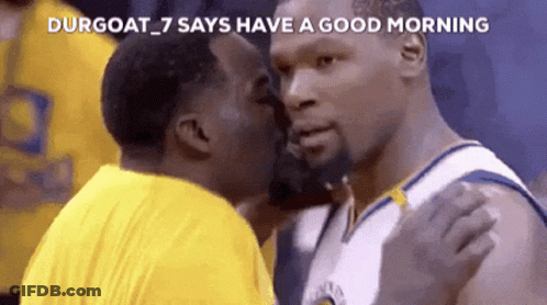 A Basketball Player Is Kissing Another Player On The Cheek GIF