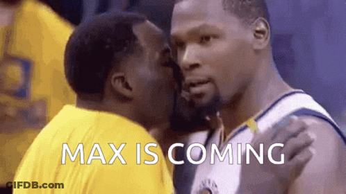 A Basketball Player Is Kissing Another Player On The Cheek While The Words Max Is Coming Are Displayed . GIF