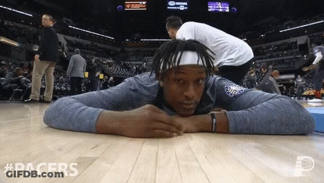 A Basketball Player Is Laying On The Floor With #Pacers Written In The Corner GIF