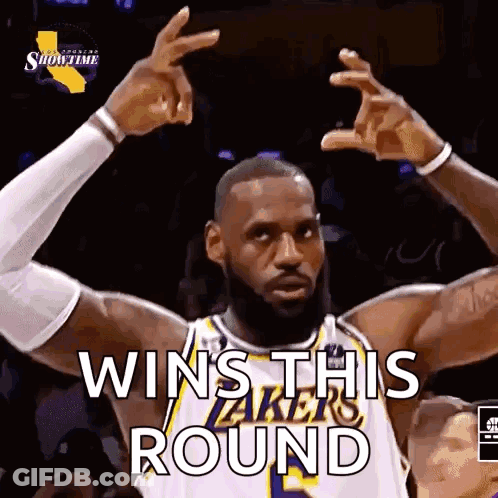 A Basketball Player Is Making A Victory Sign With His Hands . GIF
