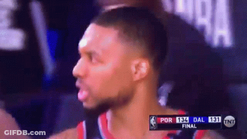 A Basketball Player Is On A Television Screen With A Scoreboard That Says Por 13 Dal 131 GIF