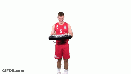 A Basketball Player Is Playing A Keyboard While Wearing A Number 5 Jersey . GIF