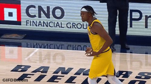 A Basketball Player Is Running On A Court With A Cno Financial Group Sign In The Background GIF