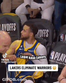 A Basketball Player Is Sitting In The Stands During A Game And Talking To Someone . GIF