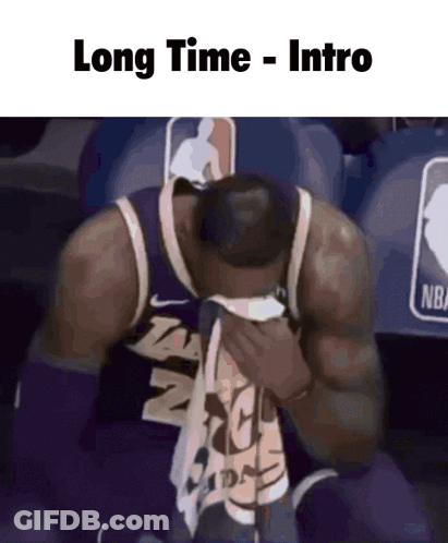 A Basketball Player Is Sitting In The Stands With His Head In His Hands And The Caption Long Time Intro GIF